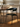 Cadeira Mila com assento em courino sintético PU e base em aço carbono ou champagne. Preto #cor_preto